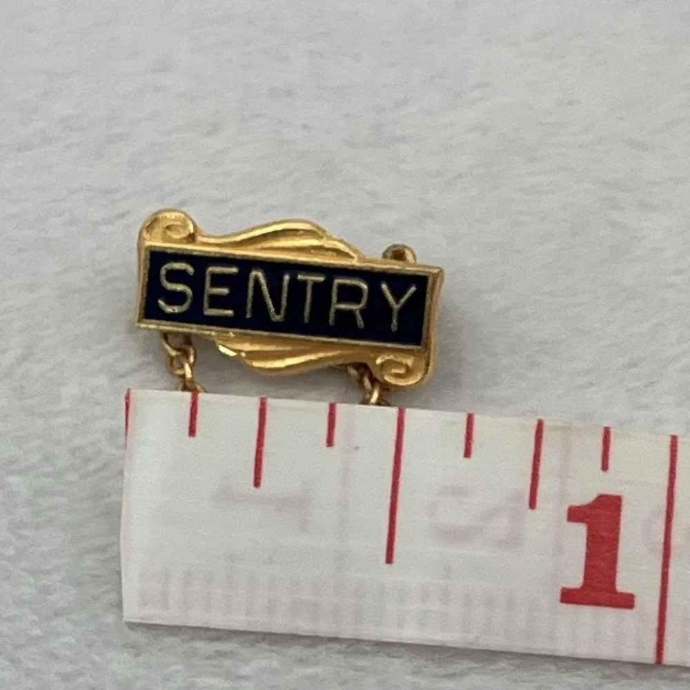 Vintage Sentry Insurance Gold Tone Black Enamel Lapel Pin Tie Tack Safety Chain